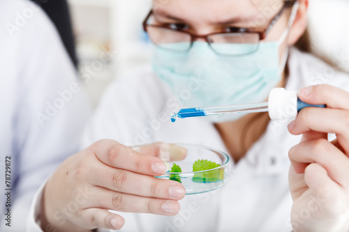 female researcher with glass equipment in the lab