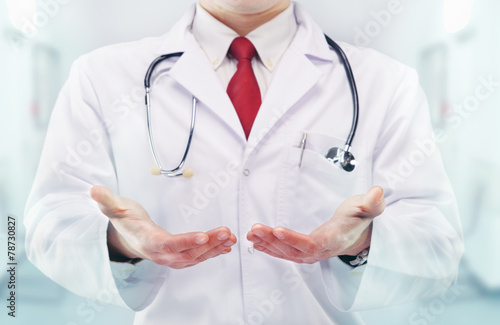 Doctor with stethoscope and clean hands in a hospital