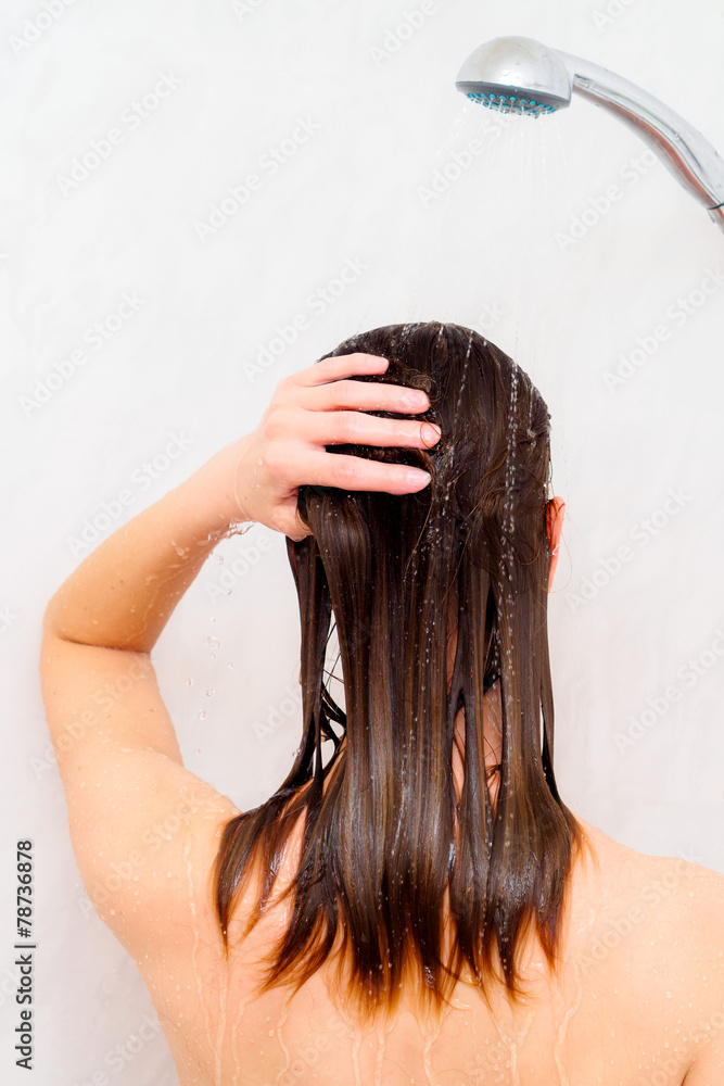 Naklejka premium Woman washing hair
