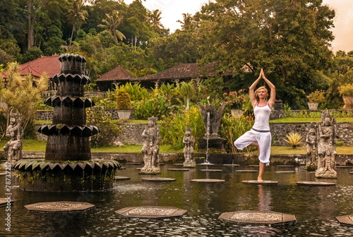 Young women near Water Palace Tirthagangga. Bali Indonesia