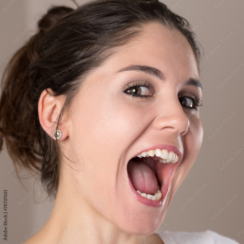 Portrait of a young brunette woman making faces Portrait of a young brunette woman making faces