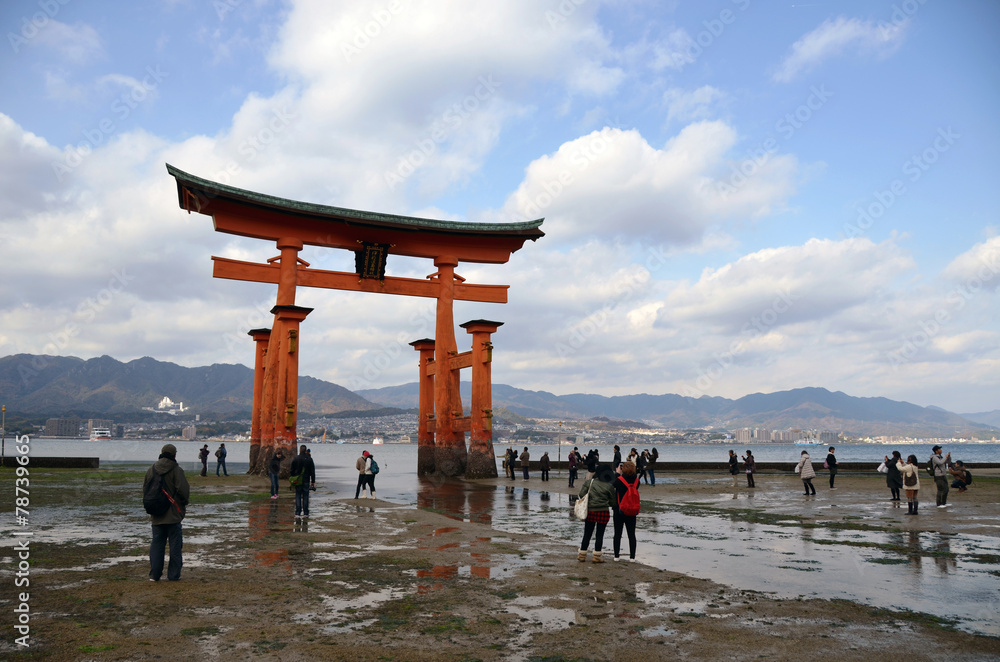 Giant Torii during low tide near Itsukushima shinto shrine Giant Torii during low tide near Itsukushima shinto shrine