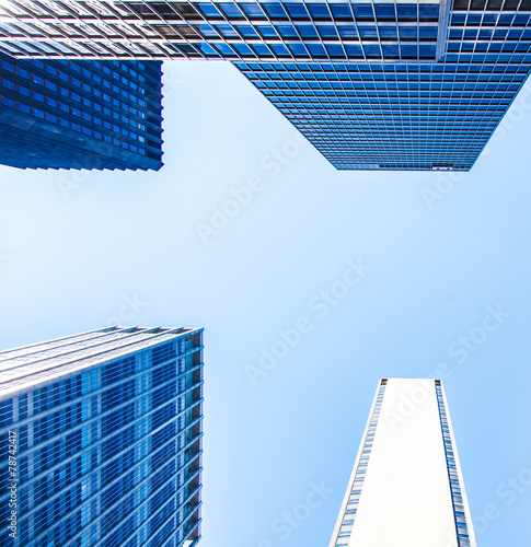 New York City skyscraper in front of bright blue sky
