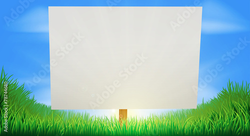 Sign in sunny grass field