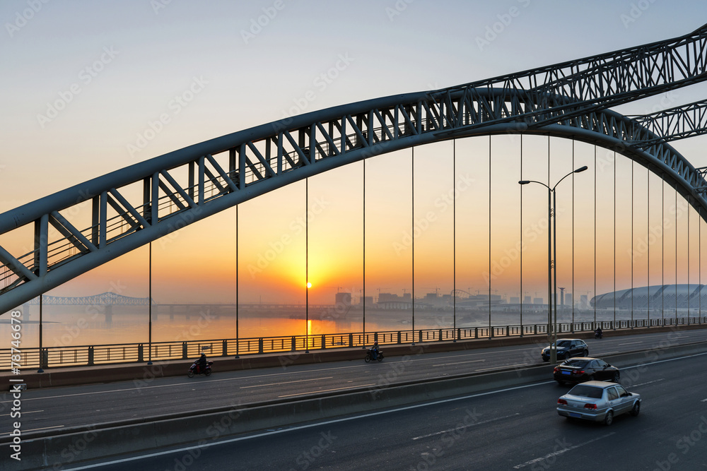 road through the bridge with blue sky background of a city