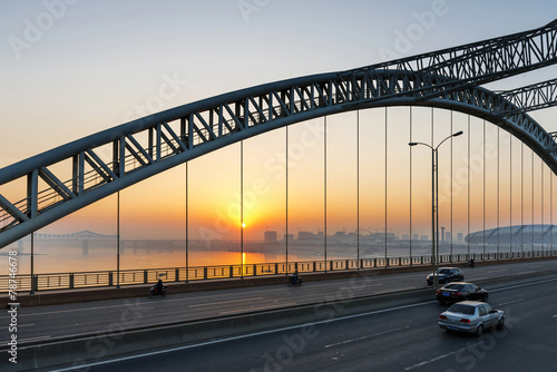 road through the bridge with blue sky background of a city
