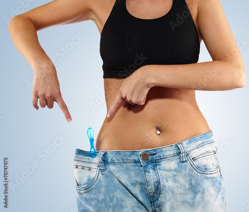 Woman with big jeans weight loss