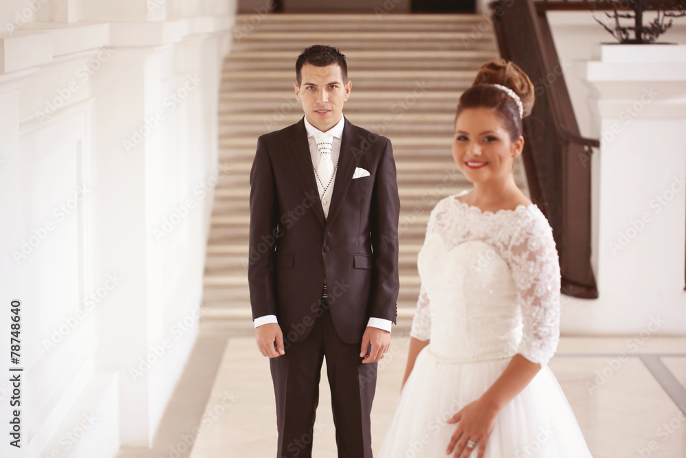 Bride and groom in a white palace Bride and groom in a white palace