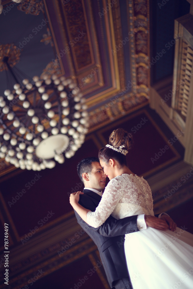 Bride and groom in a palace