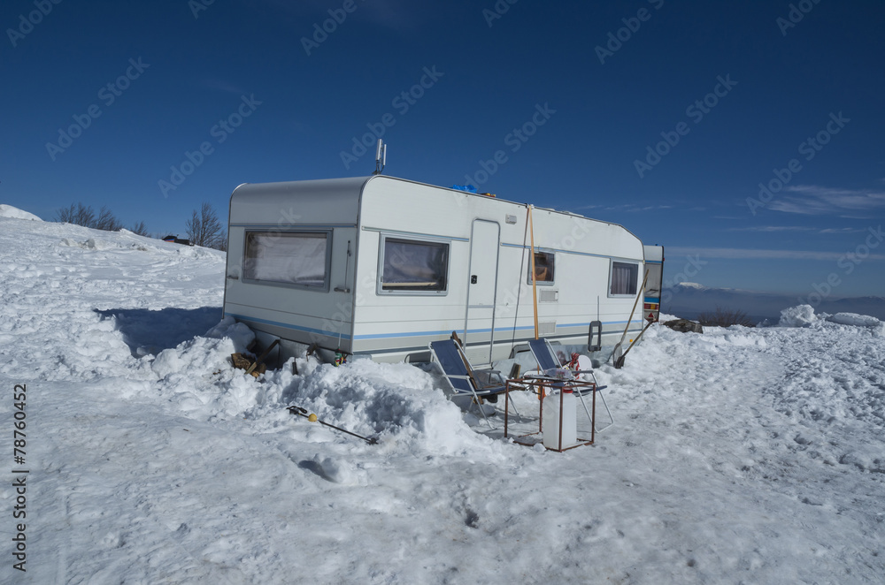 car caravan in the snow winter holidays