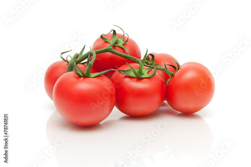 ripe fresh tomatoes closeup on a white background