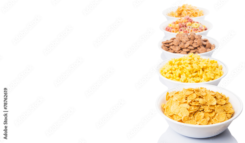 Mix variety of breakfast cereal in white bowls Mix variety of breakfast cereal in white bowls