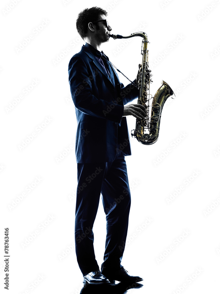 Fototapeta premium man saxophonist playing saxophone player silhouette