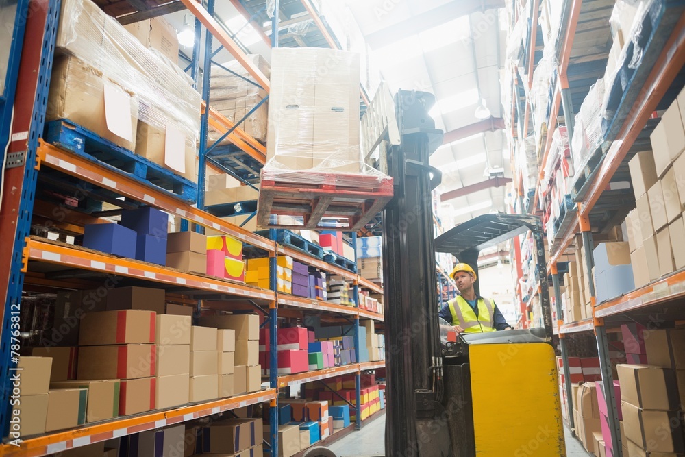Focused driver operating forklift machine Focused driver operating forklift machine