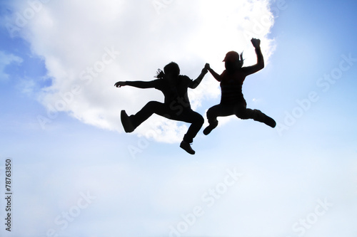 Wallpaper Mural silhouette of women and man jump to the sky Torontodigital.ca