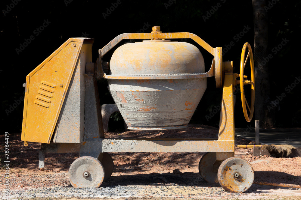 Industrial cement mixer machine at construction site. Photos | Adobe Stock