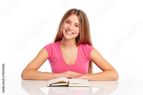 Happy woman sitting behind the desk