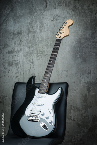 Electric guitar on a chair © Room 76 Photography