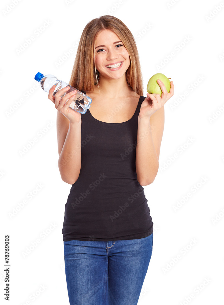 Girl with green apple and pet bottle full of water Girl with green apple and pet bottle full of water