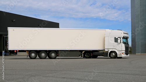 White Semi Trailer Truck on a Warehouse Yard
