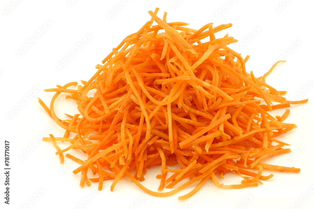 winter carrot cut in julienne on a white background winter carrot cut in julienne on a white background