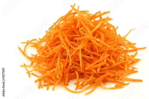 winter carrot cut in julienne on a white background