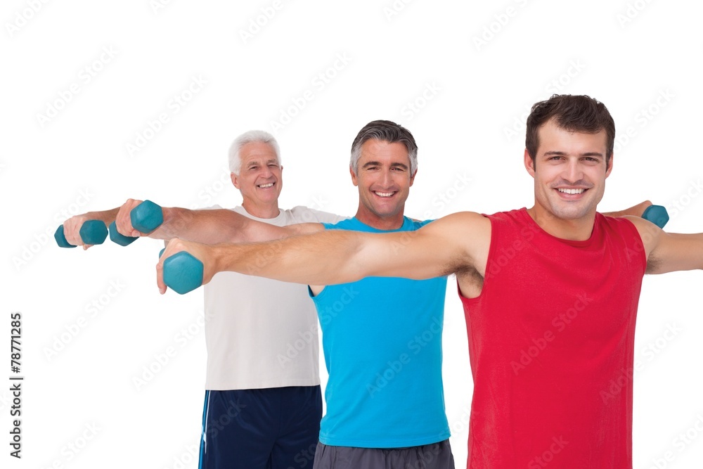Fit men lifting dumbbells together Fit men lifting dumbbells together