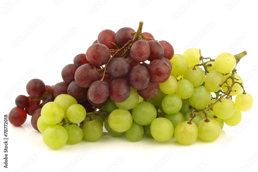 fresh red and white seedless  grapes on the vine