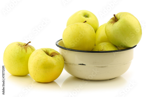 fresh "Golden Delicious" apples in an enamel bowl