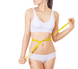 Slim woman in white underwear and measure around her body on