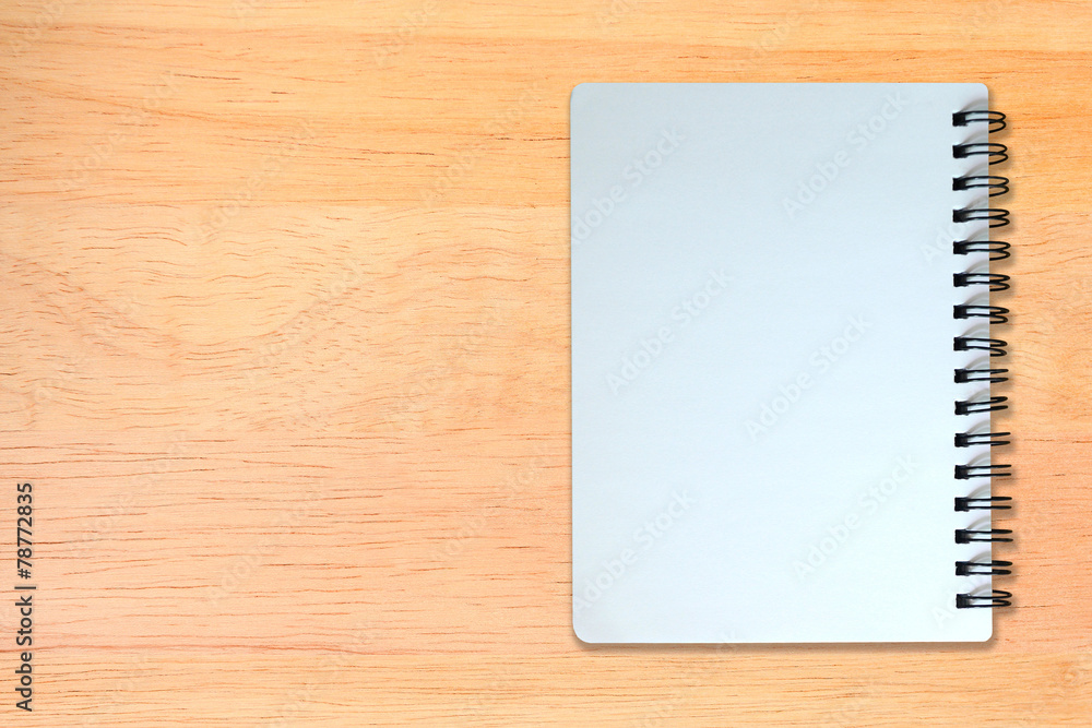 white page of notebook on wood texture white page of notebook on wood texture