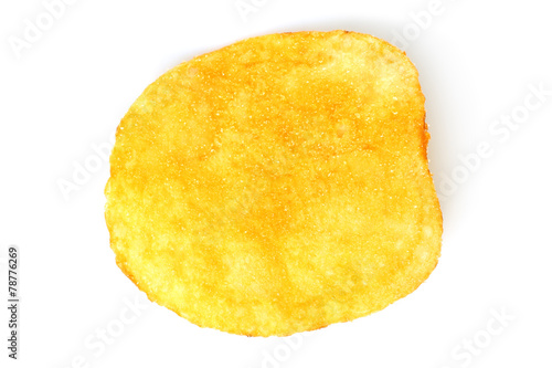 Single potato chip on white background close-up