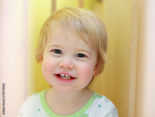 Young cute child in crib