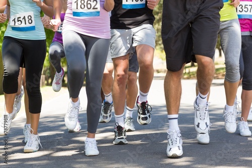 Fit people running race in park