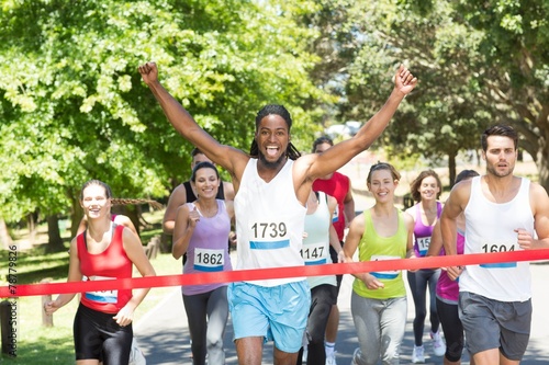 Fit people running race in park