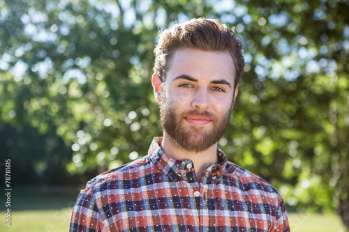 Handsome hipster smiling at camera