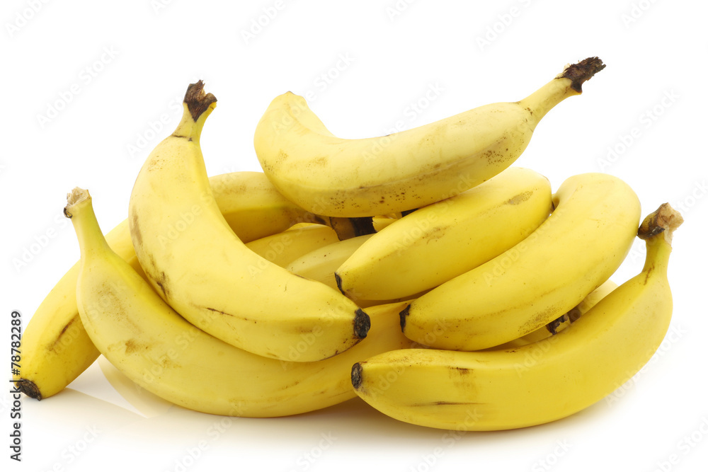 a bunch of fresh bananas on a white background