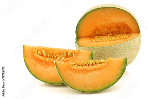 cut fresh cantaloupe melon on a white background