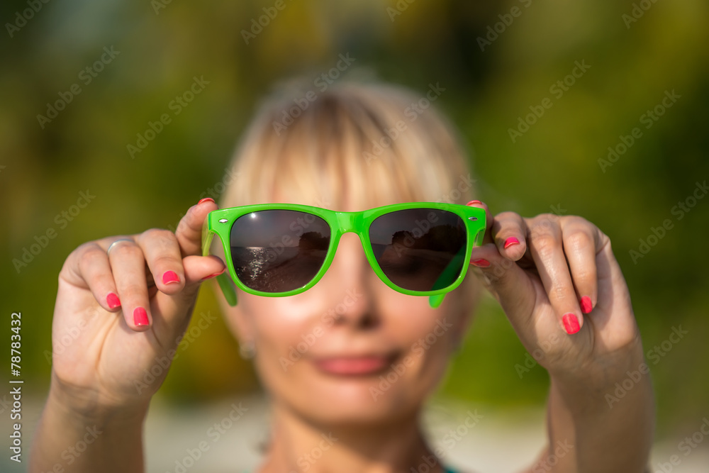Reflection of a tropical resort beash in sunglasses Reflection of a tropical resort beash in sunglasses