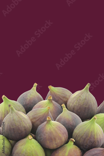 fresh figs (Ficus carica) on a purple background with copy space