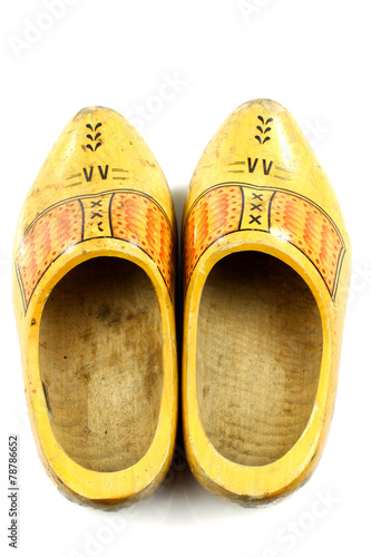 pair of traditional Dutch yellow wooden shoes seen from above o