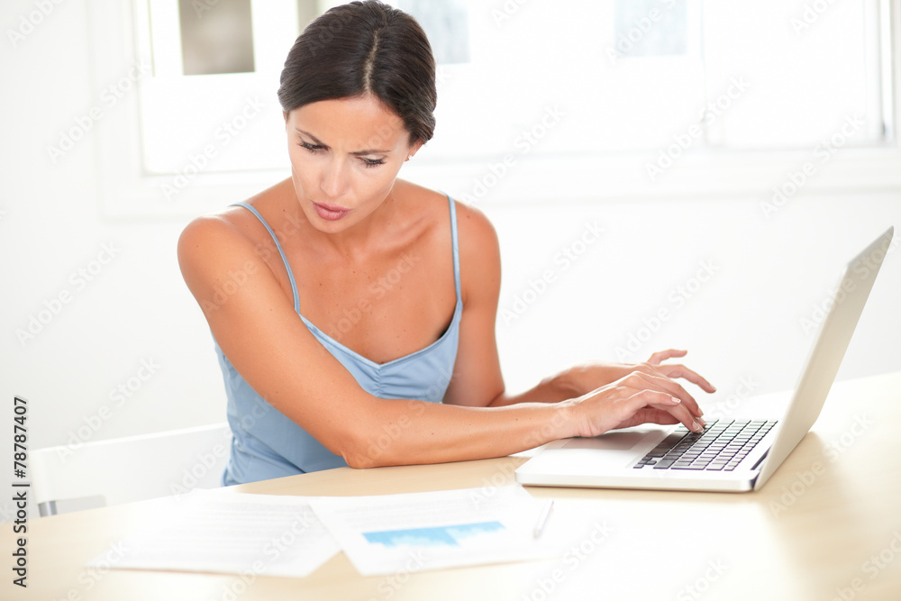 Latin woman studying on her computer Latin woman studying on her computer