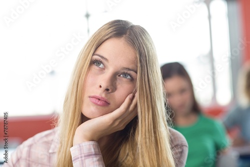 Thoughtful female student in classroom