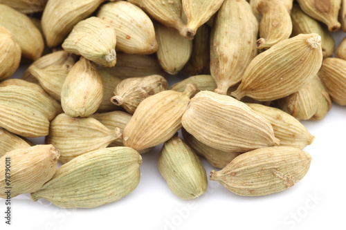 cardamom seeds on a white background