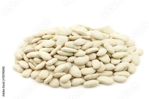 Butter beans (lima beans) in a burlap bag on a white background