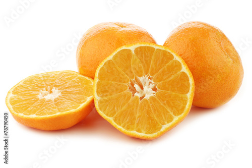  fresh tangerines and a cut one on a white background