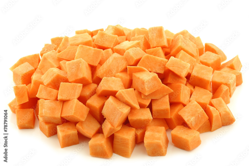 Sweet potato cubes on a white background