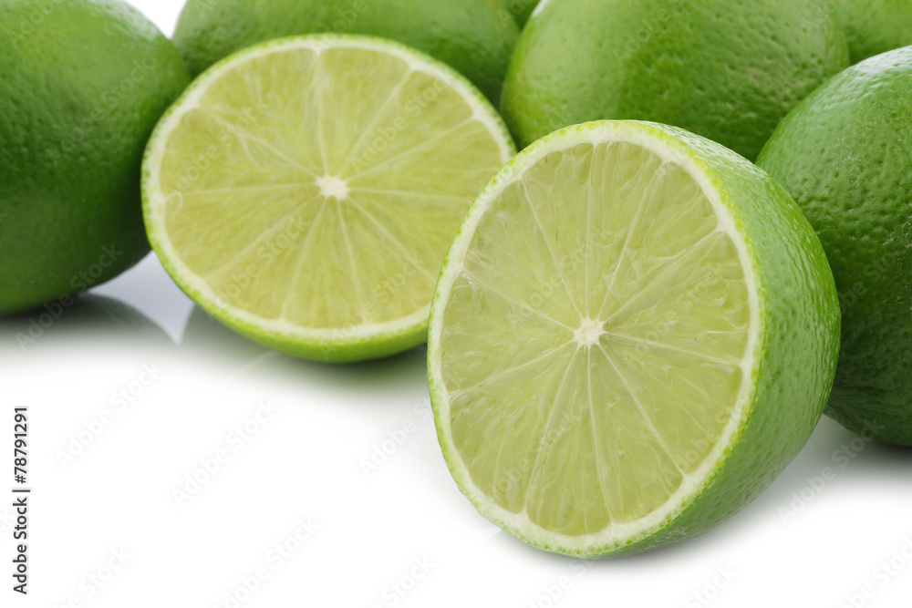 lime fruits and a cut one on a white background lime fruits and a cut one on a white background