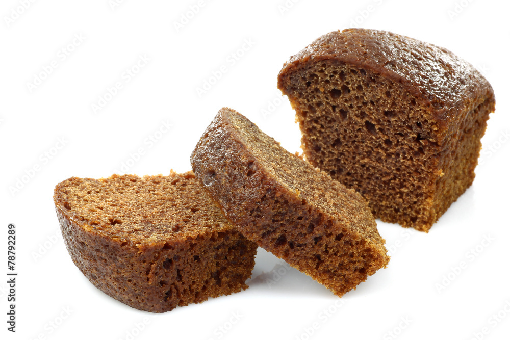 one cut chocolate cake on a white background one cut chocolate cake on a white background