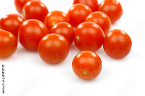 fresh whole cherry tomatoes on a white background